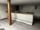 The basement features a classic bar with wood and laminate accents, situated on top of vinyl flooring at 2760 The Fontainebleau Sw, Atlanta, GA 30331