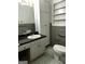 Bathroom with tile floor, large mirror, white cabinets, and matching toilet at 2760 The Fontainebleau Sw, Atlanta, GA 30331