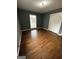 Bedroom featuring hardwood floors, painted walls, and white closet at 2760 The Fontainebleau Sw, Atlanta, GA 30331