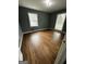Bedroom featuring hardwood floors, freshly painted walls, and natural light from large windows at 2760 The Fontainebleau Sw, Atlanta, GA 30331