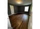 Bedroom with refinished hardwood floors, gray paint and window at 2760 The Fontainebleau Sw, Atlanta, GA 30331