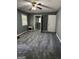 Bedroom with gray carpet and walls, open doorway leading to bathroom at 2760 The Fontainebleau Sw, Atlanta, GA 30331