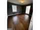 Bedroom featuring refinished hardwood floors, painted walls, and natural light at 2760 The Fontainebleau Sw, Atlanta, GA 30331