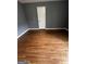Slanted bedroom with refinished hardwood floors and gray paint at 2760 The Fontainebleau Sw, Atlanta, GA 30331