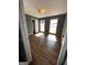 Bright bedroom featuring hardwood floors, freshly painted walls, and natural light from large windows at 2760 The Fontainebleau Sw, Atlanta, GA 30331