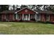 Charming red brick home with a well-manicured lawn and landscaped flowerbeds at 2760 The Fontainebleau Sw, Atlanta, GA 30331