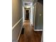 Hallway featuring hardwood floors, painted walls, and white trim at 2760 The Fontainebleau Sw, Atlanta, GA 30331