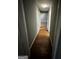 Hallway with refinished hardwood floors and gray paint at 2760 The Fontainebleau Sw, Atlanta, GA 30331