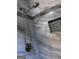 Close-up of shower with silver fixtures, marble-style tile and built-in niche at 2760 The Fontainebleau Sw, Atlanta, GA 30331