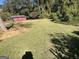 A lush backyard with a detached shed and open grassy area, perfect for outdoor activities at 2502 Miriam Ln, Decatur, GA 30032