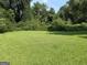 This expansive backyard offers lush green grass and abundant space, ideal for outdoor activities and relaxation at 2502 Miriam Ln, Decatur, GA 30032