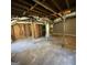 Unfinished basement featuring exposed beams and ductwork, offering ample storage space at 2502 Miriam Ln, Decatur, GA 30032