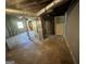 Spacious unfinished basement featuring a concrete floor and white-painted supports and ductwork at 2502 Miriam Ln, Decatur, GA 30032