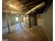 Unfinished basement features exposed ductwork, utilities, and a concrete floor awaiting customization at 2502 Miriam Ln, Decatur, GA 30032