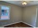 This cozy bedroom features a ceiling fan and natural light from the window, offering comfort and charm at 2502 Miriam Ln, Decatur, GA 30032