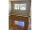 Bedroom with hardwood floors and a window overlooking the yard at 2502 Miriam Ln, Decatur, GA 30032