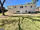 Back exterior of the home showing a covered patio and the grassy backyard at 2502 Miriam Ln, Decatur, GA 30032