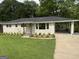 Charming single-story home with a carport, freshly painted exterior, and well-manicured front lawn at 2502 Miriam Ln, Decatur, GA 30032