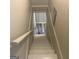 Staircase leading to another floor of the house with tan walls and a white railing at 2502 Miriam Ln, Decatur, GA 30032
