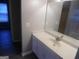 Bathroom with vanity, sink, large mirror, and bright lighting at 1742 Pine Fort Cir, Dacula, GA 30019