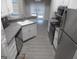 Modern kitchen with stainless steel appliances, light countertops, and ample cabinet space at 1742 Pine Fort Cir, Dacula, GA 30019