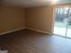 Bright living room with sliding glass door leading to backyard at 1742 Pine Fort Cir, Dacula, GA 30019
