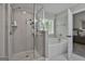 Elegant bathroom with a separate shower, bathtub, and neutral decor at 2112 Highway 54, Moreland, GA 30259