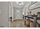 Hallway showcasing hardwood floors, neutral paint, and elegant decor, blending design and functionality at 2112 Highway 54, Moreland, GA 30259