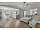Bright open-concept living area with hardwood floors flowing into the kitchen, and living room space at 2112 Highway 54, Moreland, GA 30259