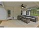 Covered patio features comfortable seating, perfect for enjoying the outdoors and entertaining guests at 2112 Highway 54, Moreland, GA 30259