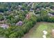 A serene neighborhood offering a peaceful setting near a golf course, enhanced by abundant trees at 157 Glen Eagle Way, Mcdonough, GA 30253