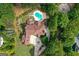 An aerial view of a luxurious property featuring a pool, landscaped grounds, and a sprawling residence at 157 Glen Eagle Way, Mcdonough, GA 30253