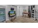Finished basement area with a wood-look flooring, mini-fridge, and sliding door at 157 Glen Eagle Way, Mcdonough, GA 30253
