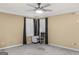 A bedroom with carpet, window blinds, curtains and a ceiling fan at 157 Glen Eagle Way, Mcdonough, GA 30253