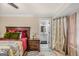 Comfortable bedroom featuring a large bed, neutral walls, and access to bathroom at 157 Glen Eagle Way, Mcdonough, GA 30253