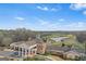 Stunning clubhouse with grand architecture and picturesque views of the golf course and lake at 157 Glen Eagle Way, Mcdonough, GA 30253