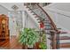 Elegant foyer featuring a staircase with decorative iron railings and hardwood floors at 157 Glen Eagle Way, Mcdonough, GA 30253