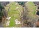 A winding golf course with sand traps, a creek, and varied green and brown tones creates a picturesque scene at 157 Glen Eagle Way, Mcdonough, GA 30253