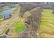 Scenic aerial view of a golf course with winding fairways and pristine greens at 157 Glen Eagle Way, Mcdonough, GA 30253