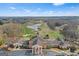 Picturesque aerial view of the golf course and serene lake, offering a tranquil recreational setting at 157 Glen Eagle Way, Mcdonough, GA 30253