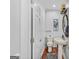Clean half bath featuring a pedestal sink, toilet, wood floors, and a decorative light fixture at 157 Glen Eagle Way, Mcdonough, GA 30253