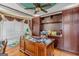 Spacious office with rich wood trim, custom cabinetry, and a large desk at 157 Glen Eagle Way, Mcdonough, GA 30253