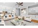 Cozy living room area featuring a comfortable sofa and stylish decor with an adjacent bar area at 157 Glen Eagle Way, Mcdonough, GA 30253