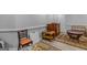 A living room with hardwood floors, a decorative rug, and vintage furniture at 157 Glen Eagle Way, Mcdonough, GA 30253