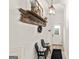 Inviting hallway with bench seating, rustic decor, and a view of the front door at 313 Dingler Rd, Moreland, GA 30259
