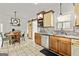 Kitchen with granite countertops, stainless steel appliances, tile floor, and adjacent dining area at 313 Dingler Rd, Moreland, GA 30259