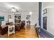 Cozy living room featuring hardwood floors, a ceiling fan, and ample natural light at 313 Dingler Rd, Moreland, GA 30259