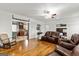 Open-concept living room with hardwood floors, seamlessly connecting to the kitchen at 313 Dingler Rd, Moreland, GA 30259