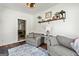 Cozy living room with hardwood floors, a comfortable seating arrangement, and a view to the adjacent dining area at 313 Dingler Rd, Moreland, GA 30259