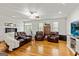 Spacious living room with hardwood floors, comfortable seating, and a ceiling fan at 313 Dingler Rd, Moreland, GA 30259